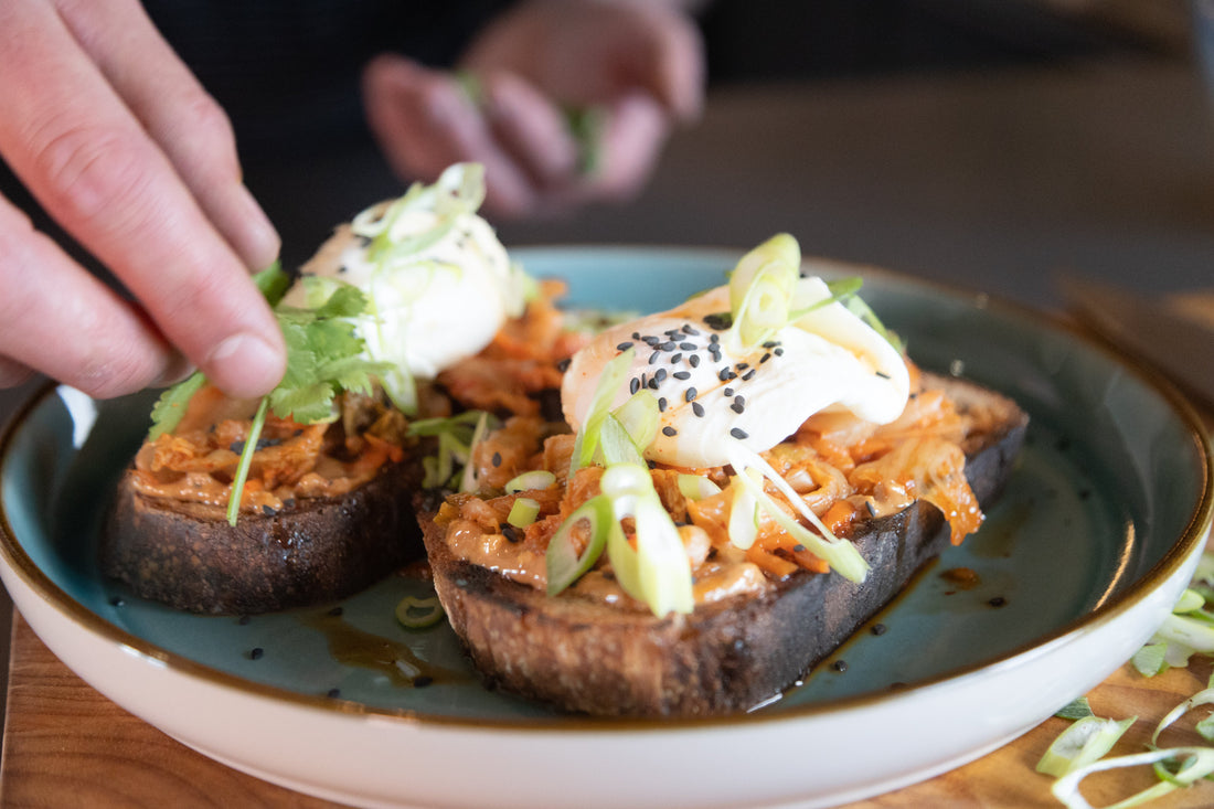 Kimchi, peanut butter and poached eggs on toast